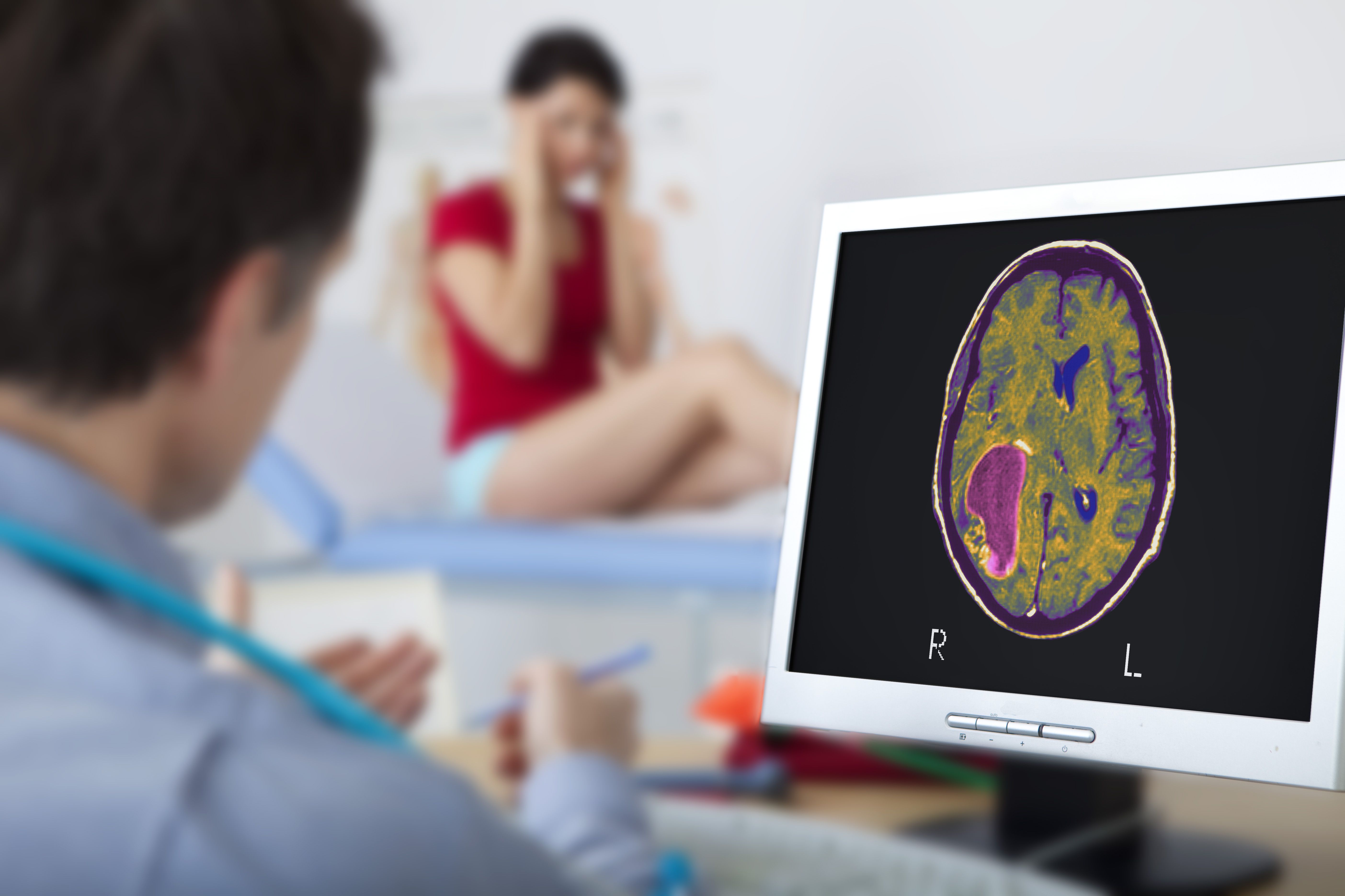 Doctor looking at patient's brain scan