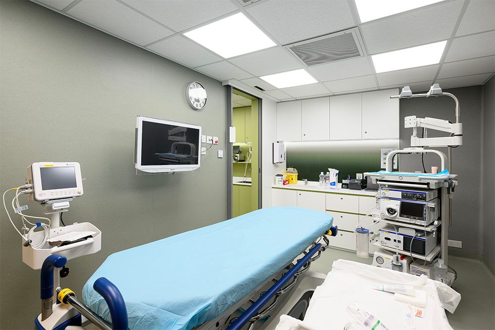 operation room white wall and blue bed