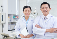 Smiling male and female doctor side by side
