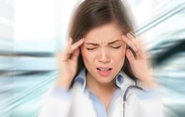 Intentionally blurry image of a woman with headache