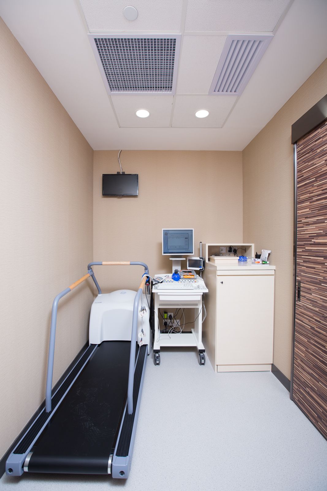 Examination room with treadmill and diagnostic equipment