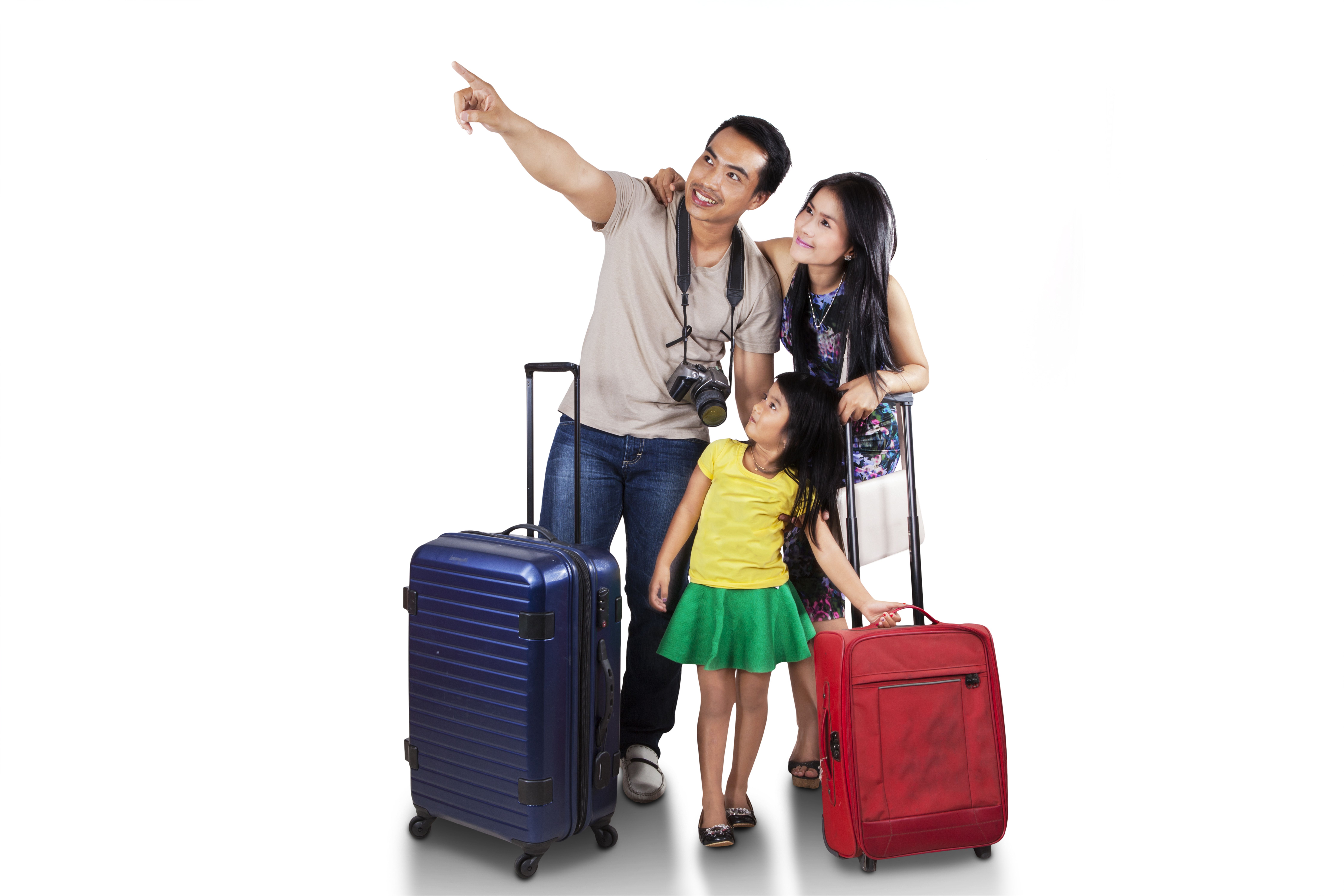 Father pointing into the distance with his wife, young daughter and their luggage
