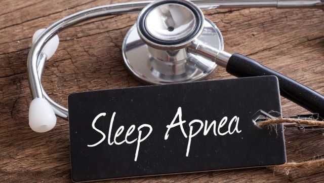 Close-up of a stethoscope and sign reading "Sleep Apnea"