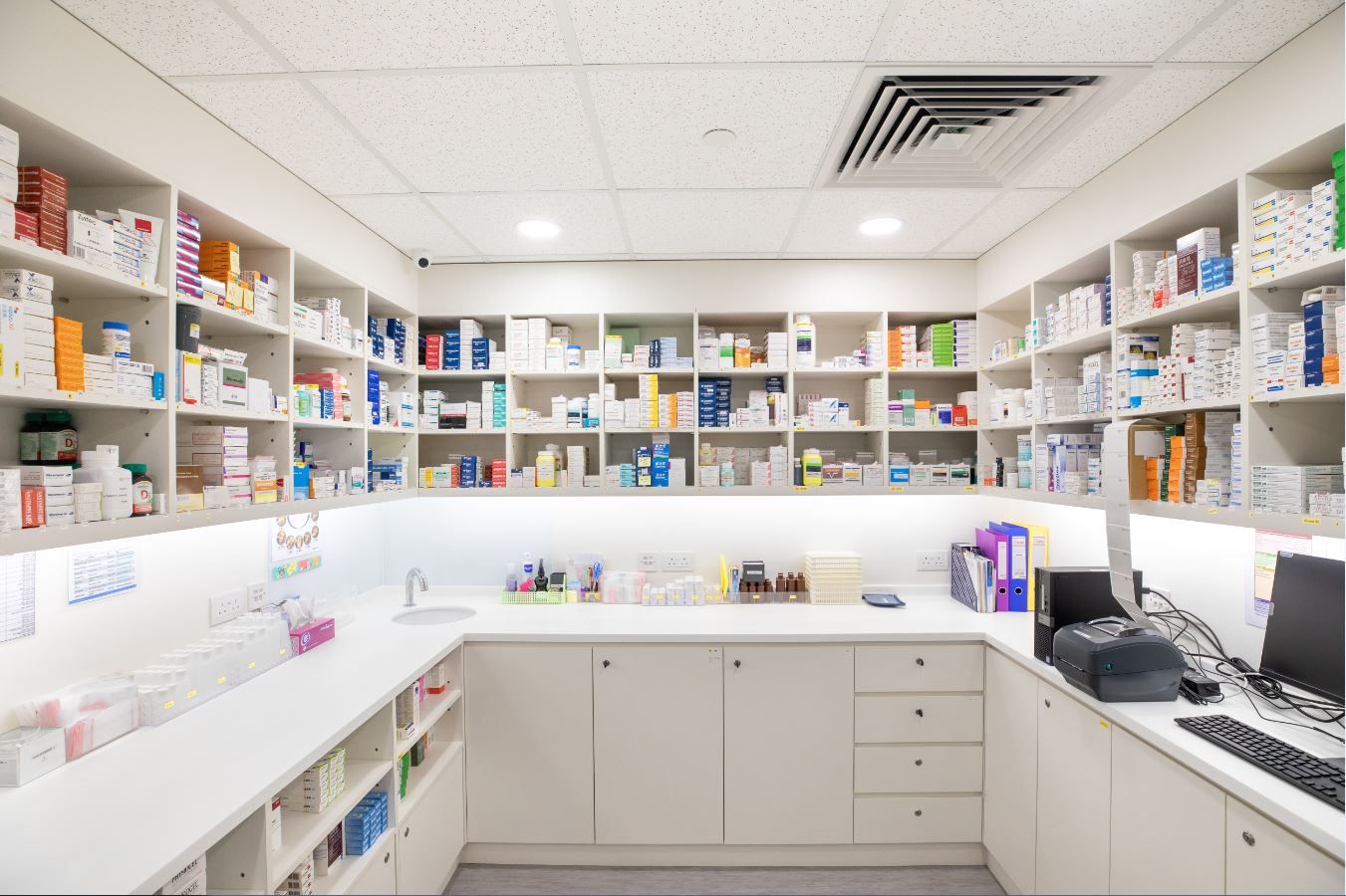 Dispensary room with shelves and cabinets of medicines